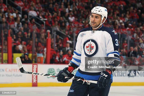 Dustin Byfuglien of the Winnipeg Jets looks on during a NHL hockey game against the Washington Capitals on November 23, 2011 at the Verizon Center in...