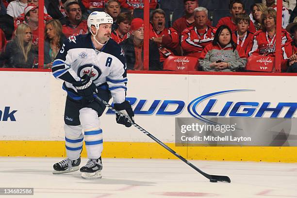 Mark Stuart of the Winnipeg Jets skates with the puck during a NHL hockey game against the Washington Capitals on November 23, 2011 at the Verizon...