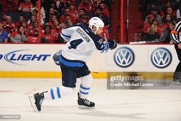 Dustin Byfuglien of the Winnipeg Jets takes a shot during a NHL hockey game against the Washington Capitals on November 23, 2011 at the Verizon...