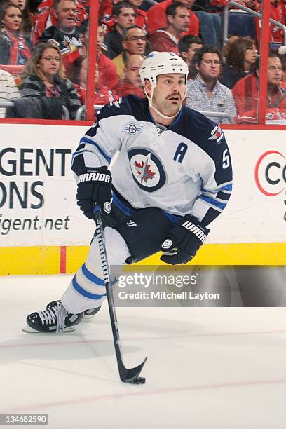 Mark Stuart of the Winnipeg Jets skates with the puck during a NHL hockey game against the Washington Capitals on November 23, 2011 at the Verizon...