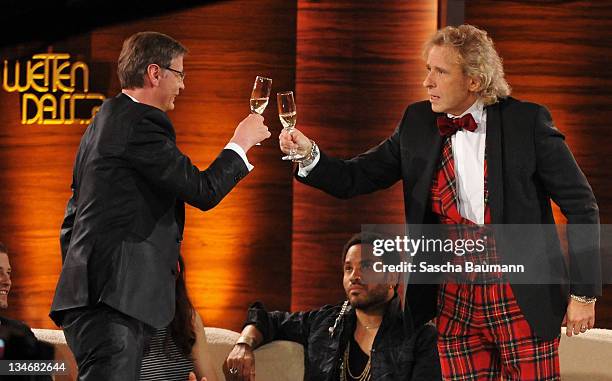 Guenther Jauch and Thomas Gottschalk drink on Jauch's promise to think over succeeding Thomas Gottschalk in his role as host during the 199th "Wetten...