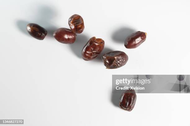 date palm flying in mid air in white background - air date stockfoto's en -beelden