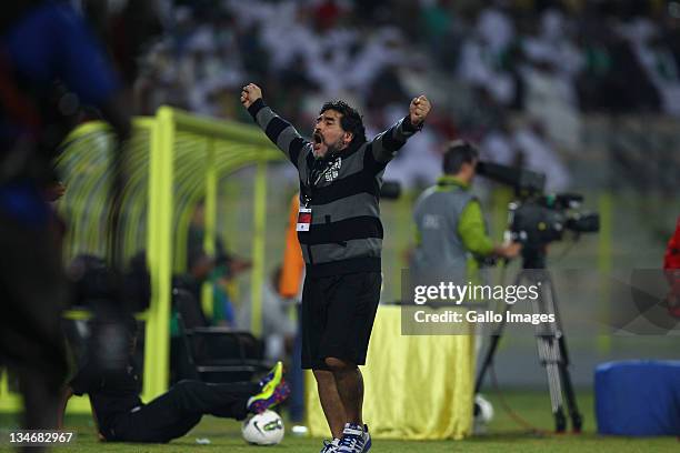 Al Wasl manager, Diego Maradona celebrates during the Etisalat League match between Al Wasl and Al Shabab at Zabeel Stadium on December 03, 2011 in...