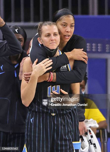 Candace Parker of the Chicago Sky hugs teammate Allie Quigley as they watch the end of the game against the Phoenix Mercury during Game Three of the...