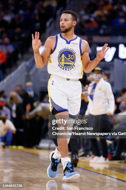 Golden State Warriors guard Stephen Curry reacts after scoring a three-point field goal against the Portland Trail Blazers in the first half of an...