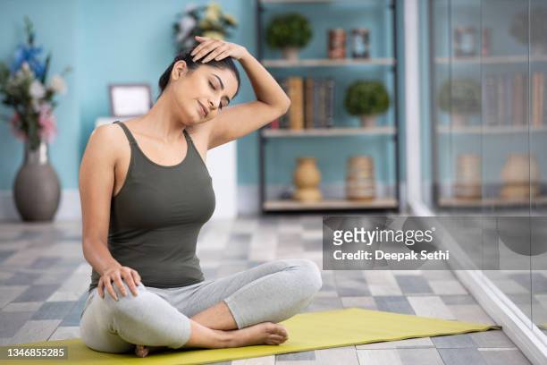 beautiful attractive young woman doing yoga exercising at home, health concept, fitness concept, stock photo - yoga stock pictures, royalty-free photos & images