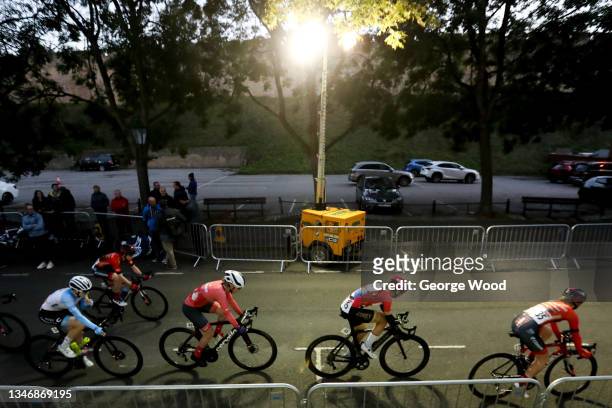 Temporary street light shines down on the riders in the Women's Circuit Race during the HSBC UK National Road Championships on October 15, 2021 in...