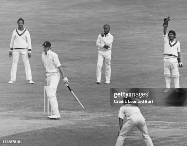 West Indies slip fielders Garfield Sobers and Rohan Kanhai look on as wicketkeeper Deryck Murray raises his arm in appeal as England captain Tony...