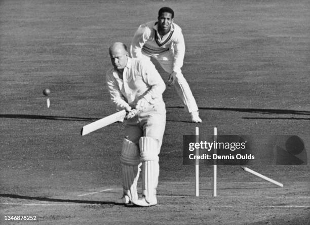 Tony Lock of England is clean bowled middle stump off a delivery by West Indies right arm fast bowler Wes Hall during the second innings of the Fifth...