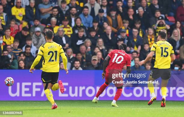 Sadio Mane of Liverpool scores their side's first goal during the Premier League match between Watford and Liverpool at Vicarage Road on October 16,...