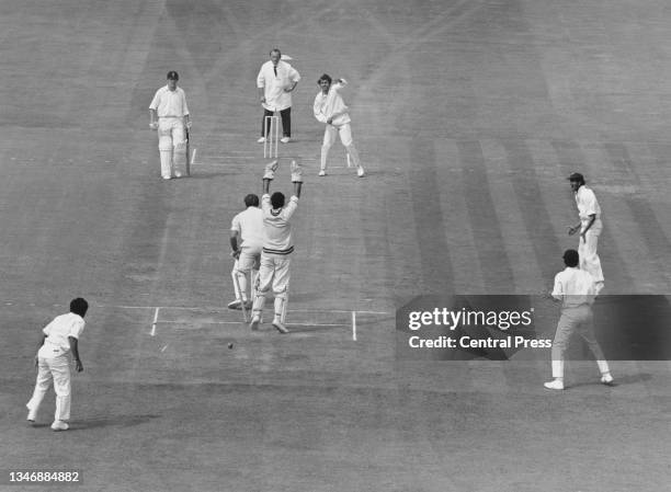 Wicketkeeper Farokh Engineer of India raises his arms in celebration after John Edrich of England is bowled out for 0 off the bowling of Bhagwath...