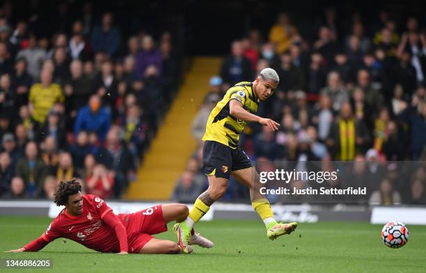 Cucho Hernandez of Watford misses a chance as he is tackled by by Trent Alexander-Arnold of Liverpool FC during the Premier League match between...