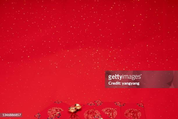 chinese new year decoration on a red background flag of good fortune and lump of gold - chinese new year red envelope stock pictures, royalty-free photos & images