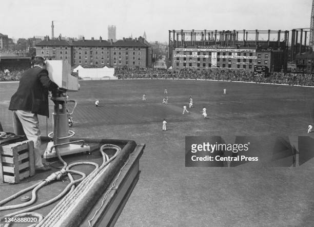 British Broadcasting Corporation television camera follows play at the wicket as Leonard Hutton and Maurice Leyland of England bat in the 1st innings...