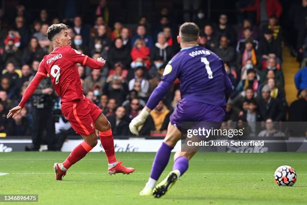 Roberto Firmino of Liverpool scores their team's fifth goal completing his hat-trick during the Premier League match between Watford and Liverpool at...