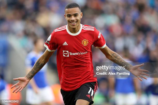 Mason Greenwood of Manchester United celebrates after scoring their side's first goal during the Premier League match between Leicester City and...