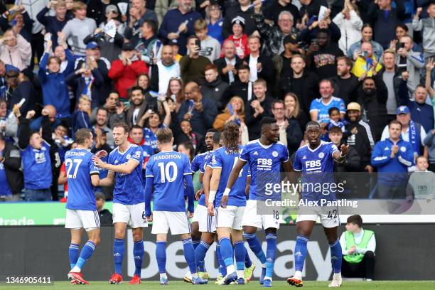 Youri Tielemans of Leicester City celebrates with teammates after scoring their side's first goal during the Premier League match between Leicester...