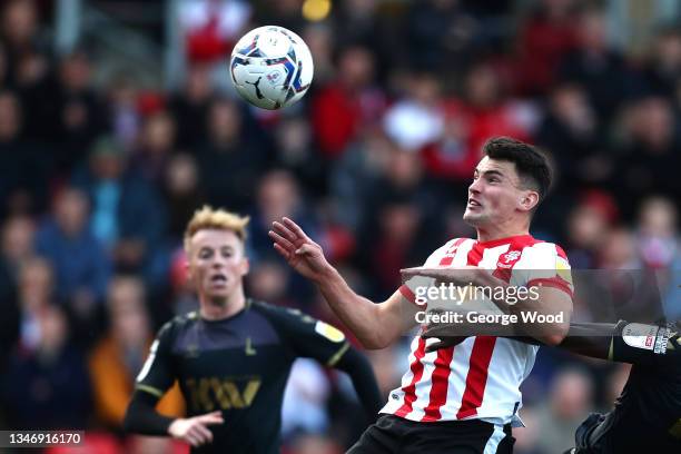 Regan Poole of Lincoln City scores their side's second goal during the Sky Bet League One match between Lincoln City and Charlton Athletic at LNER...