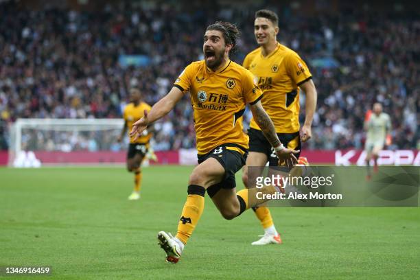 Ruben Neves of Wolverhampton Wanderers celebrates after scoring their side;s third goal during the Premier League match between Aston Villa and...