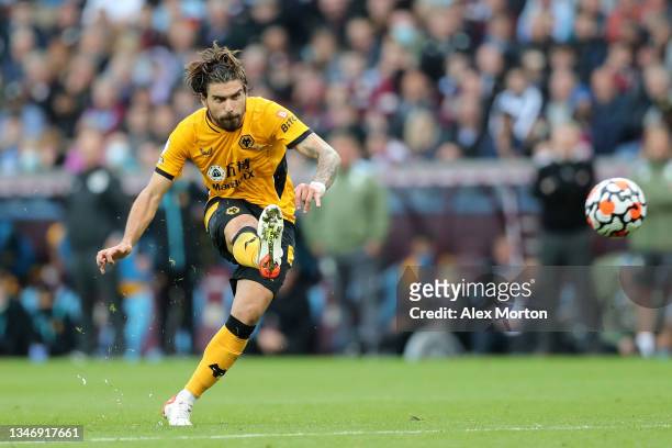 Ruben Neves of Wolverhampton Wanderers scores their team's third goal from a free kick during the Premier League match between Aston Villa and...