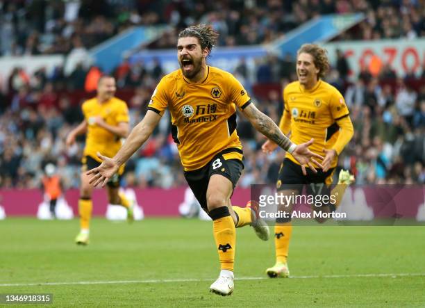Ruben Neves of Wolverhampton Wanderers celebrates after scoring their side's third goal during the Premier League match between Aston Villa and...