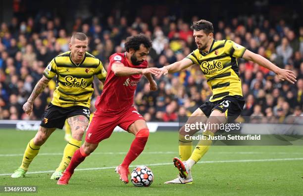 Mohamed Salah of Liverpool takes on Craig Cathcart of Watford on his way to scoring the 4th Liverpool goal during the Premier League match between...