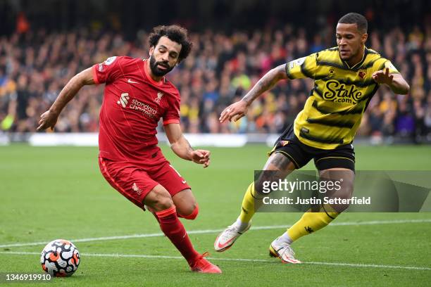 Mohamed Salah of Liverpool takes on William Troost-Ekong of Watford FC during the Premier League match between Watford and Liverpool at Vicarage Road...
