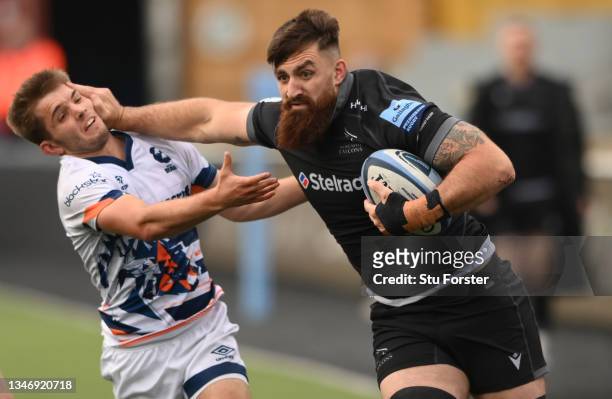 Falcons player Gary Graham hands off Harry Randall on the charge during the Gallagher Premiership Rugby match between Newcastle Falcons and Bristol...