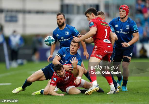 Garry Ringrose of Leinster battles for possession with Ryan Conbeer of Scarlets during the United Rugby Championship match between Leinster and...