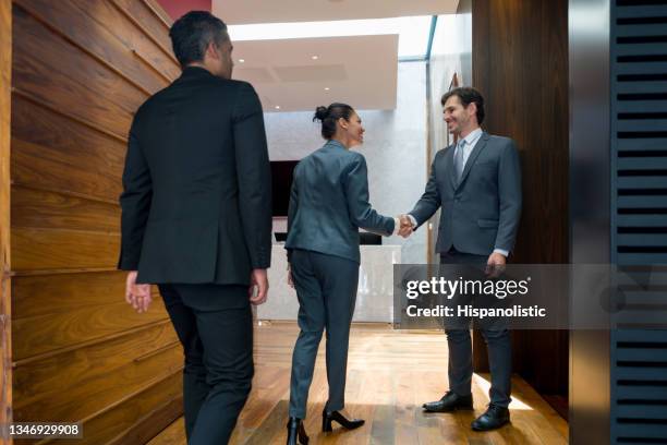 happy business man greeting his associates with a handshake - pact for mexico stock pictures, royalty-free photos & images