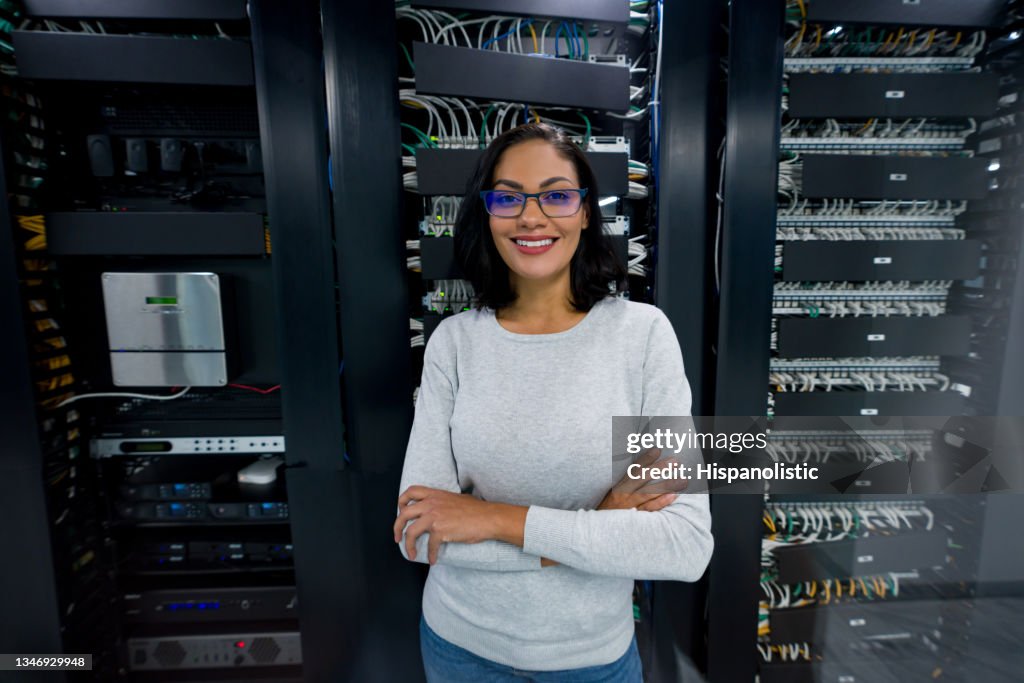 Happy Computer Engineer Working In The Server Room High-Res Stock Photo ...