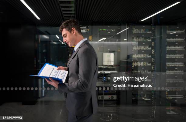 computer engineer working in the server room - cloud computing services stock pictures, royalty-free photos & images