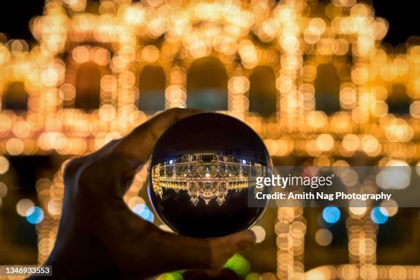 the royal mysore palace decked up for dasara viewed from a crystal ball - the dussehra vijaya dashami festival stock pictures, royalty-free photos & images
