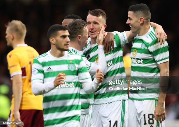 David Turnbull of Celtic is congratulated by team mates after he scores his team's second goal during the Cinch Scottish Premiership match between...