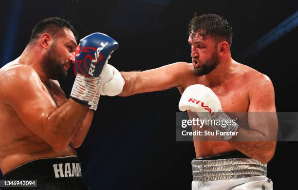 Hughie Fury punches Christian Hammer during the Heavyweight fight between Hughie Fury and Christian Hammer at Utilita Arena on October 16, 2021 in...