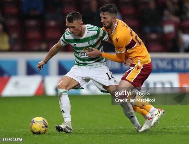 David Turnbull of Celtic battles for possession with Kaiyne Woolery of Motherwell during the Cinch Scottish Premiership match between Motherwell FC...