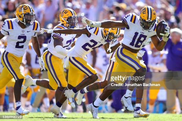 Damone Clark of the LSU Tigers celebrates an interception during the second half against the Florida Gators at Tiger Stadium on October 16, 2021 in...