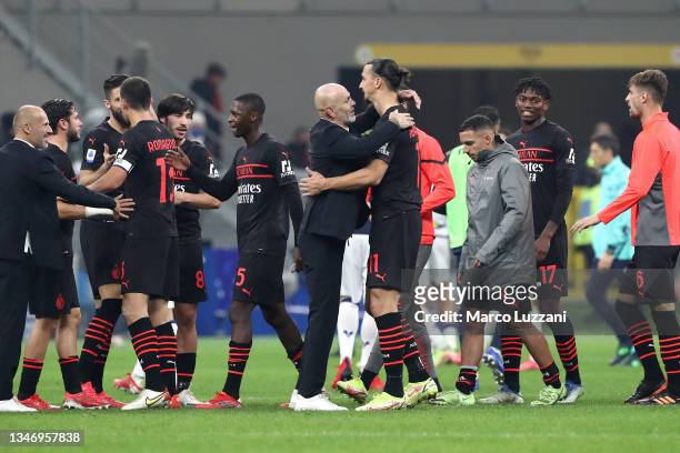 Stefano Pioli embraces Zlatan Ibrahimovic of AC Milan after their sides victory in the Serie A match between AC Milan and Hellas Verona FC at Stadio...