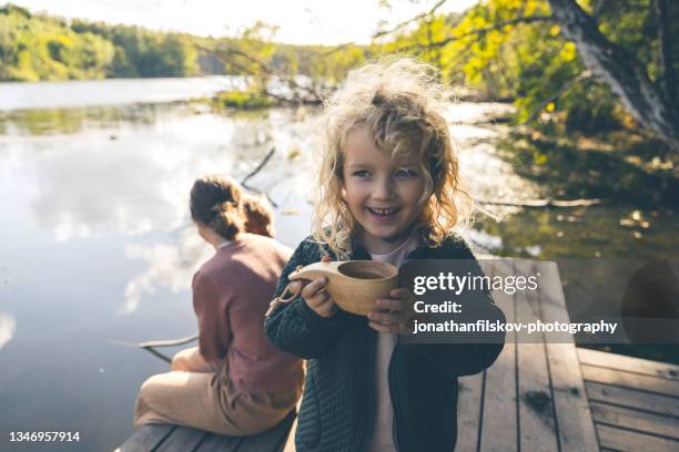 mother with kids outdoors - traditionally scandinavian imagens e fotografias de stock