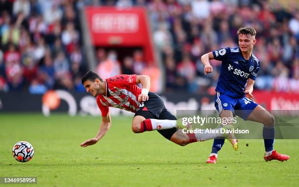 Mohamed Elyounoussi of Southampton is tackled by Jamie Shackleton of Leeds United during the Premier League match between Southampton and Leeds...