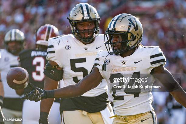 Running back Rocko Griffin of the Vanderbilt Commodores reacts after scoring a touchdown with offensive lineman Tyler Steen during the second quarter...