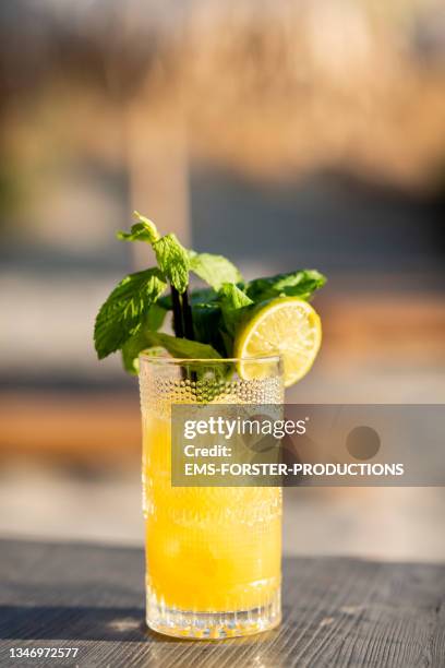 cocktail drink - lime standing on a table on a beach bar - cocktails beach stock pictures, royalty-free photos & images