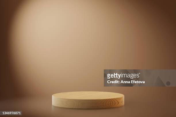 wooden podium for product demonstration. three  dimensional stage on pastel beige background. front view. - prise de vue en studio photos et images de collection