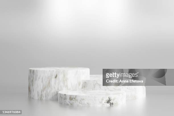 white marble podium for product demonstration. three  dimensional stage on light background. front view. creative trendy concept of the year. - marble bildbanksfoton och bilder