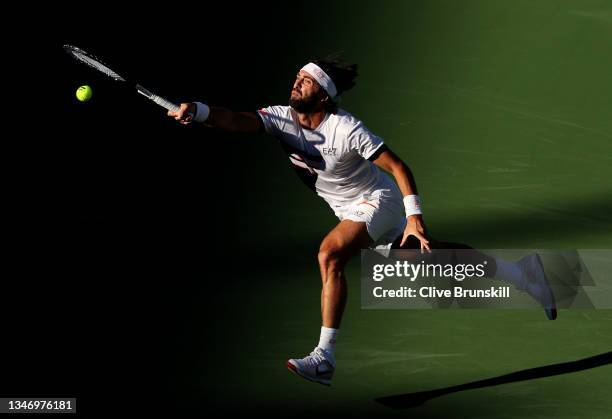 Nikoloz Basilashvili of Georgia plays a forehand against Taylor Fritz of the United States during their semifinal match on Day 13 of the BNP Paribas...