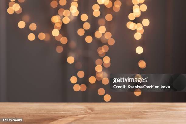 christmas holiday background, christmas table background with decorated christmas tree and garlands. beautiful empty christmas room. new year frame for your text - christmas bokeh ストックフォトと画像