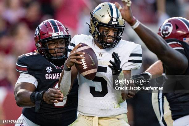 Quarterback Mike Wright of the Vanderbilt Commodores is sacked by defensive lineman Zacch Pickens of the South Carolina Gamecocks during the fourth...