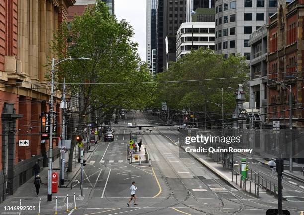 An empty Bourke Street is seen on October 17, 2021 in Melbourne, Australia. Premier Andrews announced that Victoria's Lockdown will end at 11.59pm on...