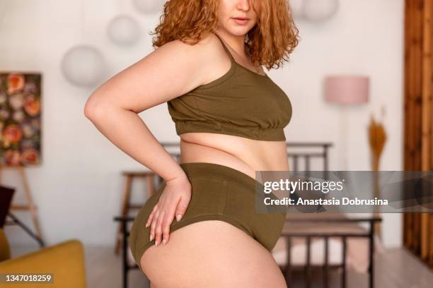 beautiful woman in underwear in bedroom. - fat redheads stock pictures, royalty-free photos & images