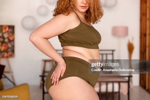 beautiful woman in underwear in bedroom. - fat redhead stock pictures, royalty-free photos & images